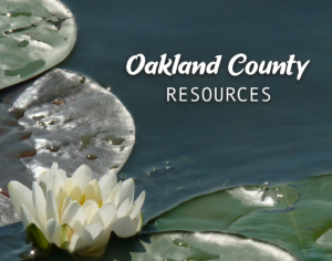 Image of multiple green lilypads and one white flower in water with "Oakland County Resources" in white text.